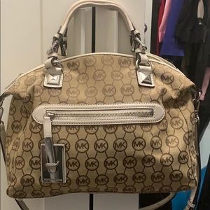 Michael Kors tan and white purse.